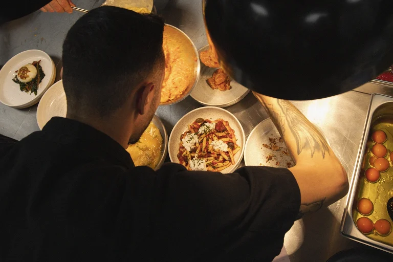 Noci's chef plating food from above