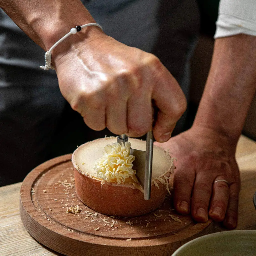 A chef preparing Monk's Head cheese